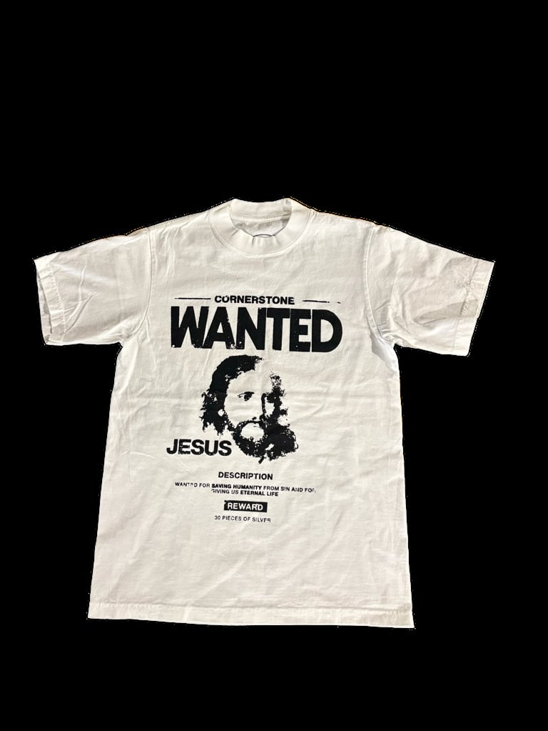Cream colored t-shirt with a black wanted poster design featuring a portrait and text reading Cornerstone Wanted Jesus