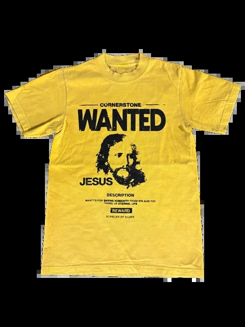 Yellow t-shirt with a wanted poster design featuring a portrait and text reading Cornerstone Wanted Jesus with reward details